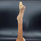 Elegant evening gown with intricate beading on a dark background