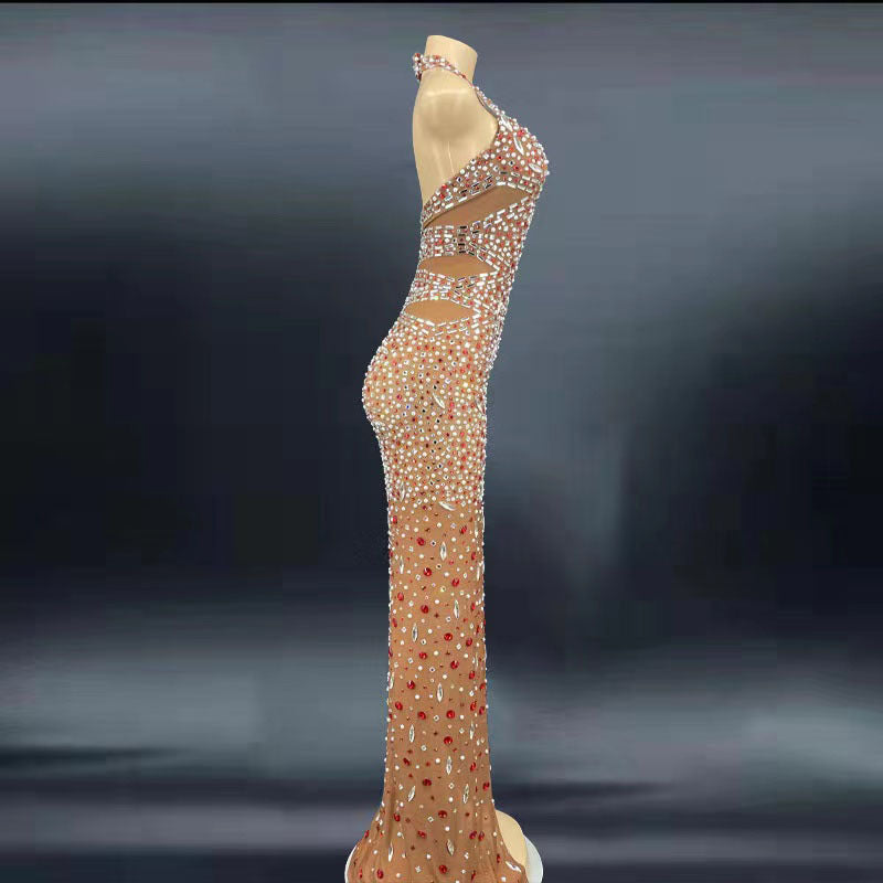 Elegant evening gown with intricate beading on a dark background