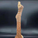 Elegant evening gown with intricate beading on a dark background
