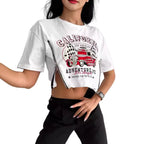 Person wearing a white t-shirt with a graphic design on a plain background