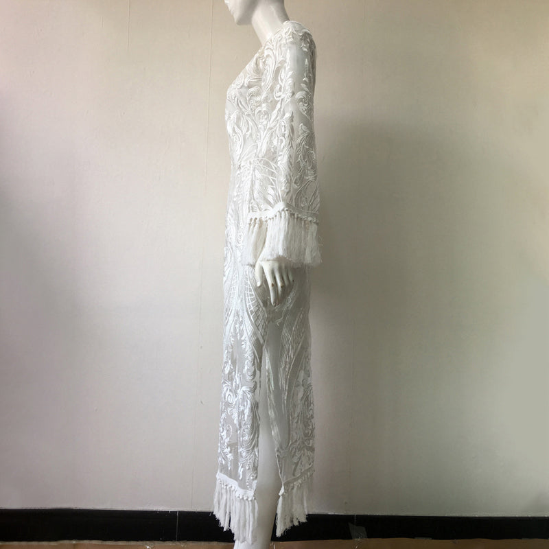 Mannequin wearing a white lace dress against a plain background
