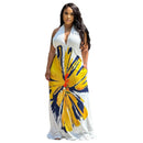 Woman wearing a white dress with yellow and blue abstract pattern on a white background