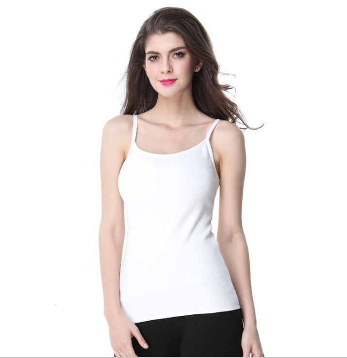 Woman wearing a white tank top against a white background